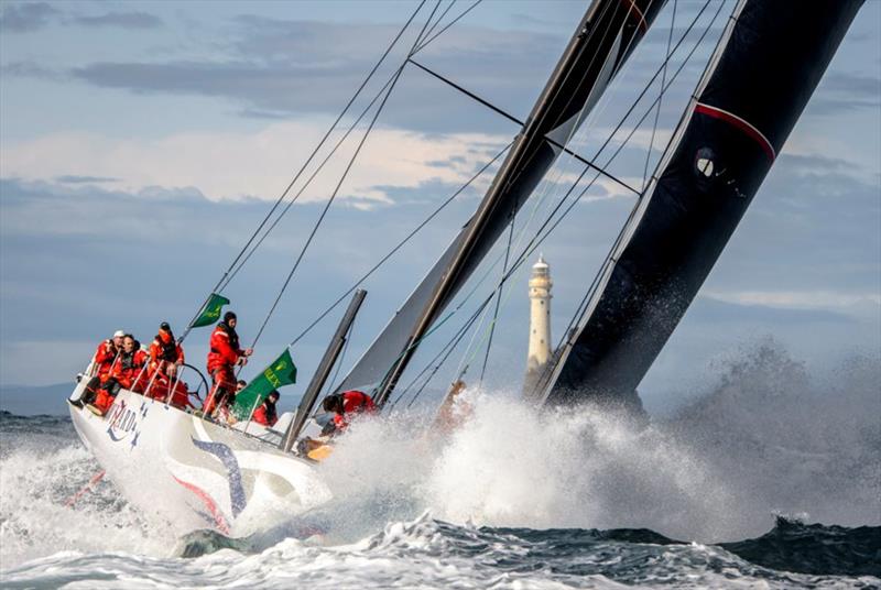 The American yacht Wizard passes the Fastnet Rock on the second day of the 2019 Rolex Fastnet Race photo copyright Rolex / Kurt Arrig taken at Royal Ocean Racing Club and featuring the IRC class