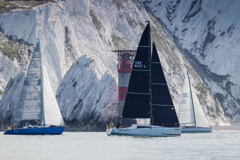 Yachts pass the Needles as they race round the Isle of Wight photo copyright Paul Wyeth / pwpictures.com taken at Royal Ocean Racing Club and featuring the IRC class