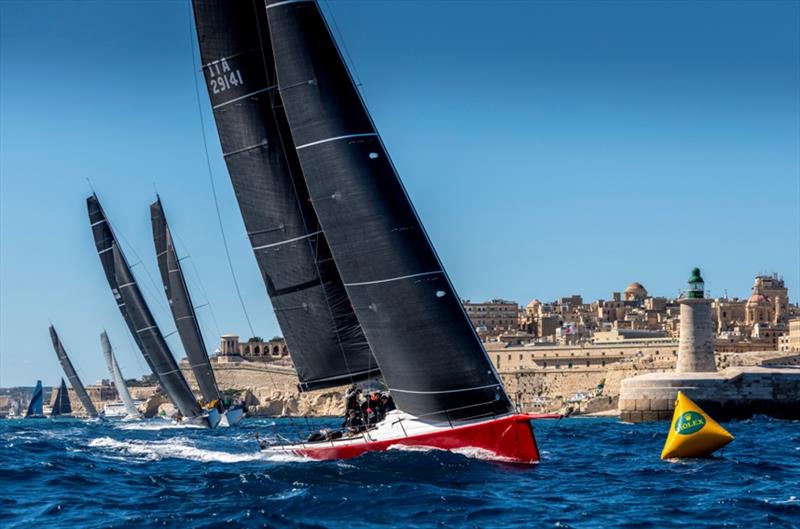 Freccia Rossa leads her rivals shortly after the start of the 2020 Rolex Middle Sea Race photo copyright Rolex / Kurt Arrig taken at Royal Malta Yacht Club and featuring the IRC class