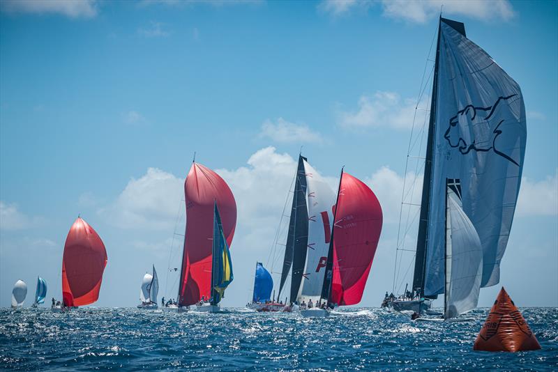 There was a lot of action at the leeward mark, with all classes converging, and the Maxi fleet coming in hot on day 2 of the St. Maarten Heineken Regatta - photo © Laurens Morel