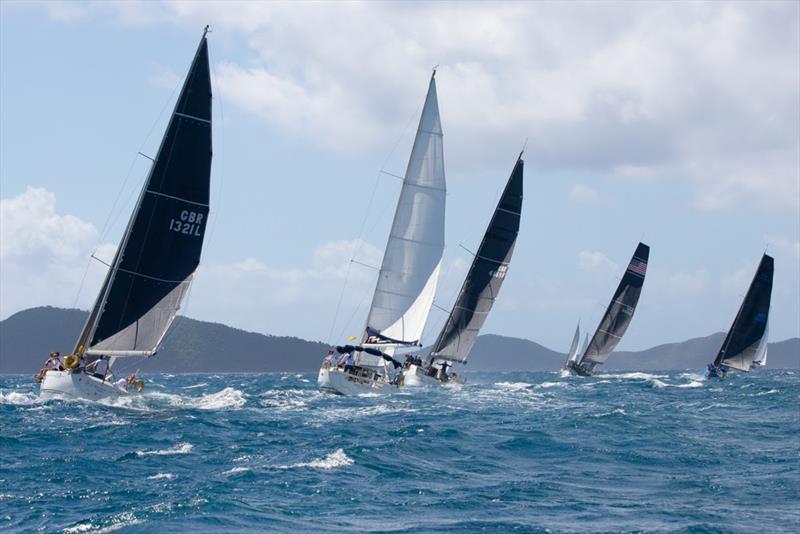 The fleet head off for Jost van Dyke on the race to Foxy's - 2022 BVI Sailing Festival photo copyright Alastair Abrehart taken at Royal BVI Yacht Club and featuring the IRC class