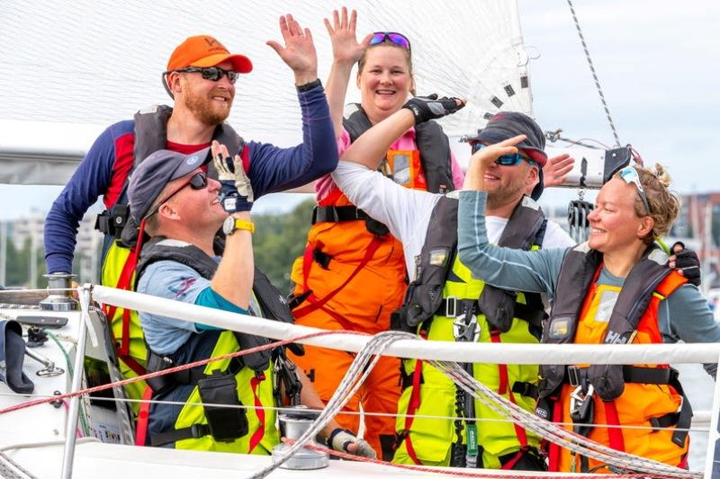 High Five: Celebrating their win on the Finnish H-323 Silver Moon II photo copyright Pepe Korteniemi / www.pepekorteniemi.fi taken at Royal Ocean Racing Club and featuring the IRC class