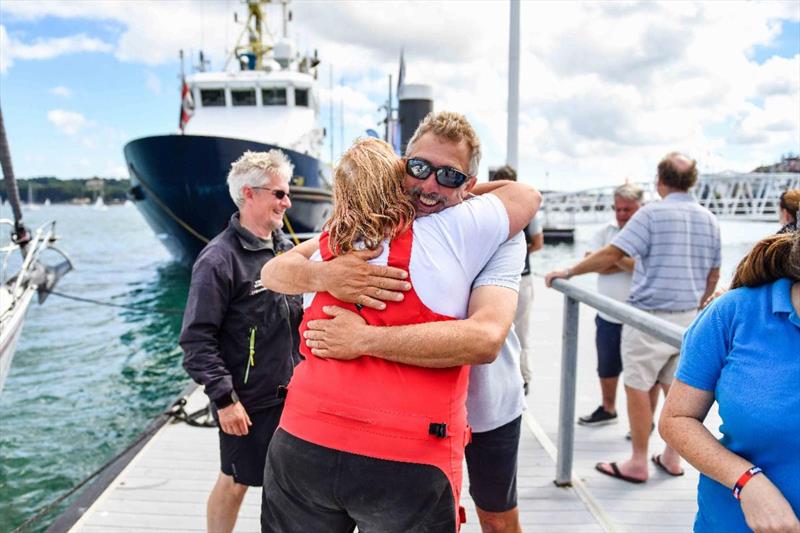 Celebrations and welcome dockside for AJ Wanderlust photo copyright James Tomlinson taken at Royal Ocean Racing Club and featuring the IRC class