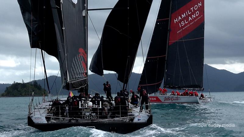 Wild Oats XI passes ahead of Andoo Comanche - Hamilton Island Race Week - Day 5 - August 26, 2022 photo copyright Bow Caddy Media taken at Hamilton Island Yacht Club and featuring the IRC class