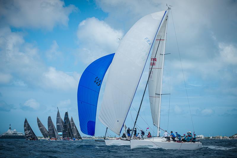 Move over superyachts, we're racing here! SMHR Race committee manages the perfect dance between fleets, with many starts and finishes going on in Simpson Bay throughout the day! photo copyright Laurens Morel taken at Sint Maarten Yacht Club and featuring the IRC class