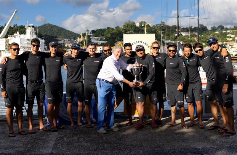 Andrew McIrvine, IMA Secretary General presents the team on the Polish National Foundation's VO70 I Love Poland with the magnificent silver IMA Transatlantic Trophy - photo © Arthur Daniel / RORC