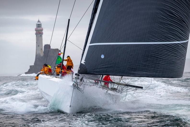 2023 Rolex Fastnet Race - Bryon Ehrhart's Lucky at the Fastnet Rock photo copyright Rolex / Kurt Arrigo taken at Royal Ocean Racing Club and featuring the IRC class