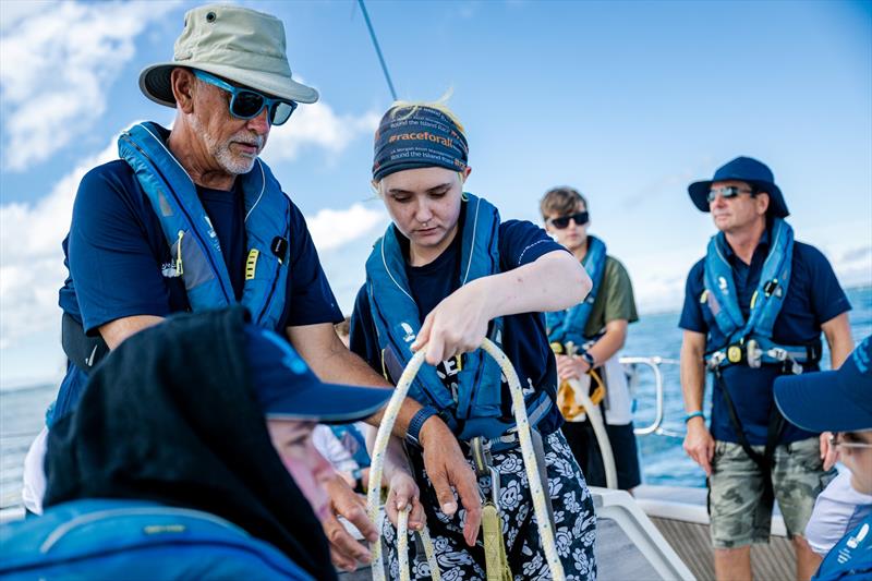 John Peckham (left) helping young people with the ropes on a Trust trip - photo © Martin Allen Photography