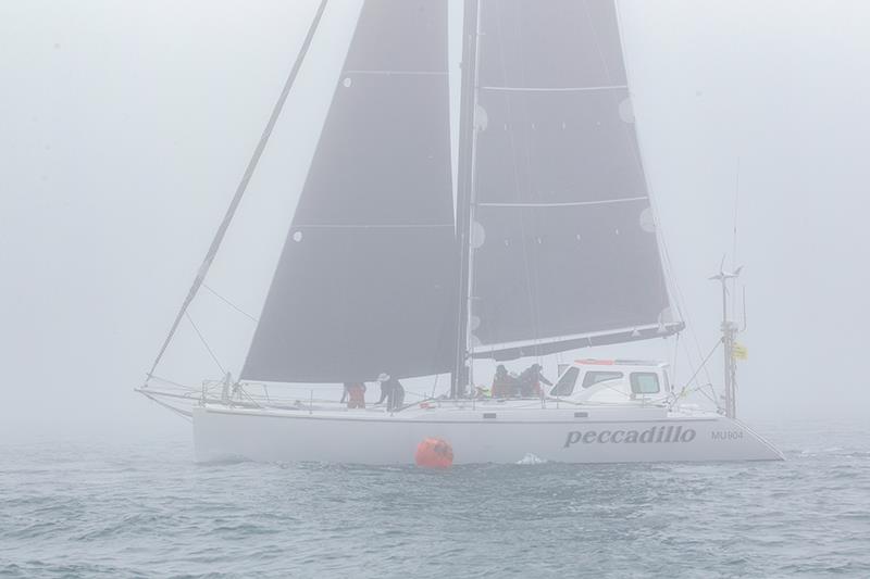 An errie sea fog sweeps through the Heads at the start of the Melbourne to Hobart. Peccadillo first boat to exit the Heads - 2023 Melbourne to Hobart Yacht Race - photo © Steb Fisher