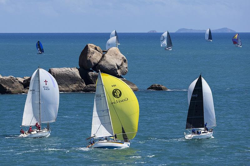 Akarana (yellow kite) in the Around the Island Race -  - SeaLink Magnetic Island Race Week photo copyright Andrea Francolini taken at Townsville Yacht Club and featuring the IRC class