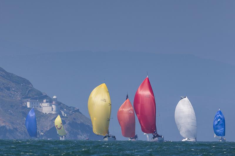 Part of the 56-strong fleet in the Volvo Round Ireland Race 2018 passing Wicklow Head lighthouse - photo © David Branigan