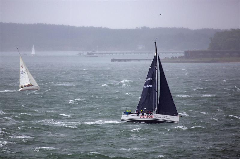 Strong winds during the 2024 Round the Island Race as the fleet pass Hurst Castle photo copyright Martin Augustus / www.sailingimages.co.uk taken at Island Sailing Club, Cowes and featuring the IRC class