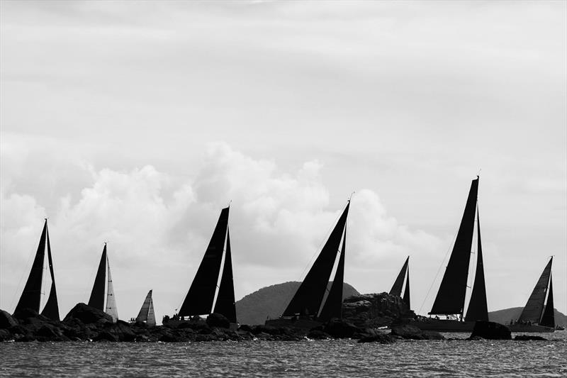 Performance Racing fleet and others pass a rocky outcrop in 2023 - photo © Andrea Francolini / ABRW