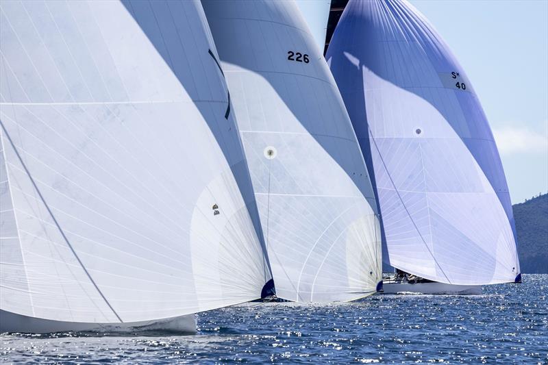 A wall of spinnakers in Rating Division 1 - Ocean Dynamics and Mount Gay Airlie Beach Race Week photo copyright Andrea Francolini / ABRW taken at Whitsunday Sailing Club and featuring the IRC class