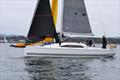 Nigel and sons on Darling, hoisting round the mark to lead the fleet downwind - Pwllheli Autumn challenge series © Gerallt Williams