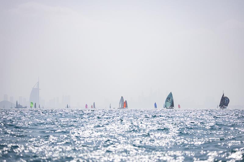 The fleet leaving Dubai - 32nd ARAMEX Dubai to Muscat Sailing Race photo copyright Mikey Brignall taken at Dubai Offshore Sailing Club and featuring the IRC class