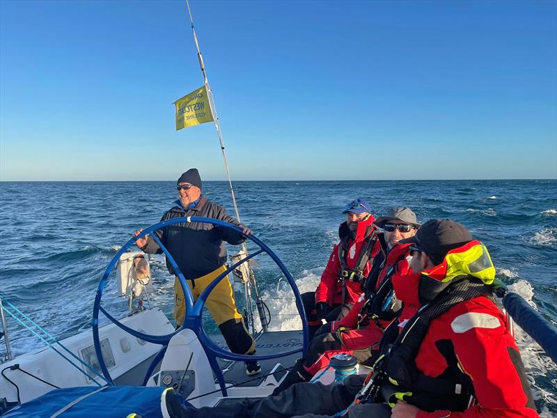 Race veteran Simon Dryden on the helm of Faster Forward chasing down The Jackal - photo © Faster Forward