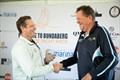 Todd Anderson, Vice Commodore of the RQYS shakes the hand of David Rose &copy; @sailorgirlhq