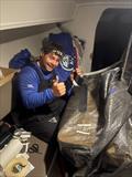 Joe Griffiths tackles sail repairs on board - RORC Round Britain and Ireland Race 2026 - Day 9