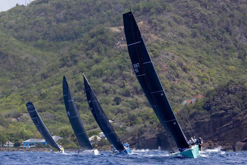 RP37 Warthog leading the fleet upwind along Antigua's rugged coastline - Antigua Racing Cup - photo © Tim Wright / Photoaction.com