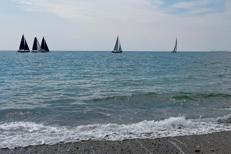 A view of Saturday's coastal racing from the beach - Pwllheli SC's May Day Series photo copyright Victoria Cox taken at Pwllheli Sailing Club and featuring the IRC class