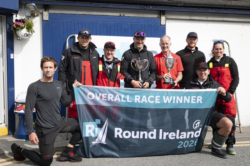 Khumbu skipper Guy Gillon (centre) with Kyran O'Grady, Race Director with Wicklow Sailing Club with the trophies for line honours and overall victory in the 704 nautical-mile Round Ireland Race photo copyright David Branigan / Oceansport taken at Wicklow Sailing Club and featuring the IRC class