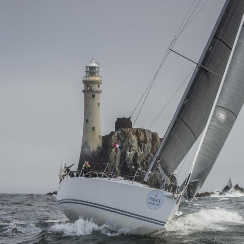Neil McGrigor's two-handed J/109, rounds the Fastnet Rock. - photo © Daniel Forster / Rolex