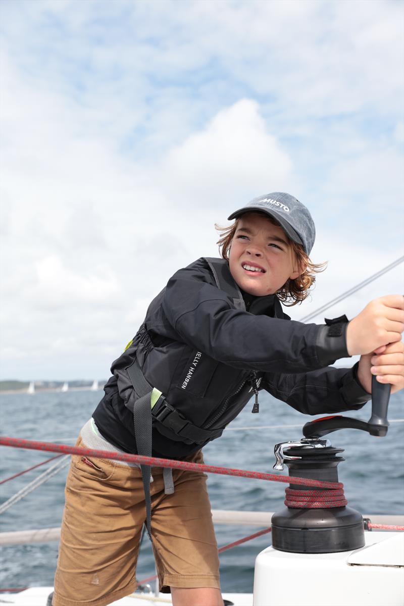 Gabriel Faulkner on the winch aboard Black Dog photo copyright Collin Faulkner taken at Royal Cornwall Yacht Club and featuring the J111 class