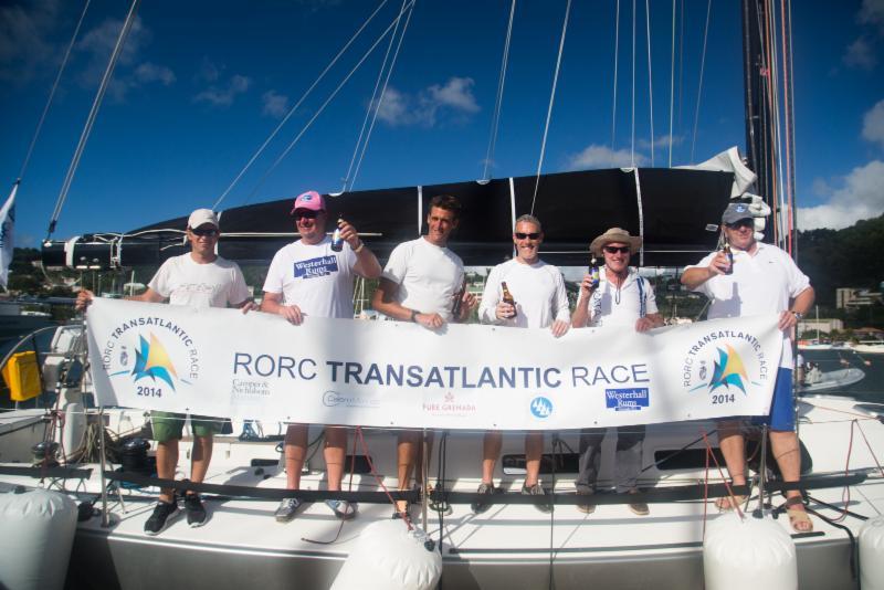 Safely on the dock in Port Louis, a happy crew on Nigel Passmore's Apollo 7 photo copyright Arthur Daniel & Orlando K Romain / RORC taken at  and featuring the J133 class