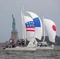 Thanks to Claire Davis for capturing this iconic picture of three of the Lady Liberty Regatta boats racing downwind under the gaze of the Statue of Liberty. You can tell the teams by their national spinnakers. This is France, Japan and the United States © Claire Davis