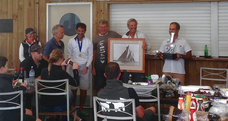 Steve Girdis and his winning crew happily lifting the trophies photo copyright Simon Grain taken at Southern Yacht Club and featuring the J/24 class