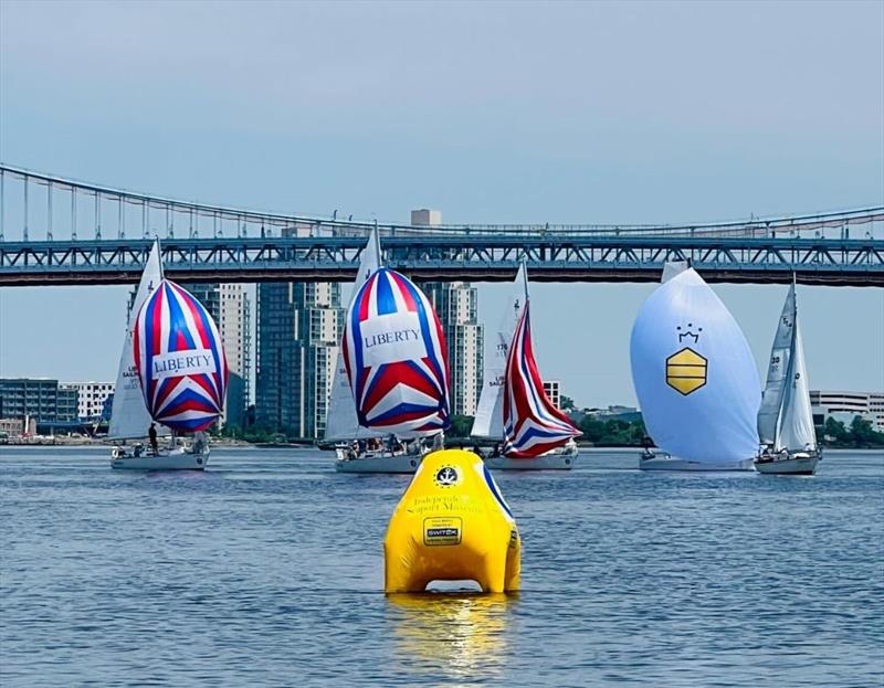 Keelboats racing in the foreground of the scenic Ben Franklin Bridge photo copyright Irina Bernatsky taken at Liberty Sailing Club and featuring the J/27 class