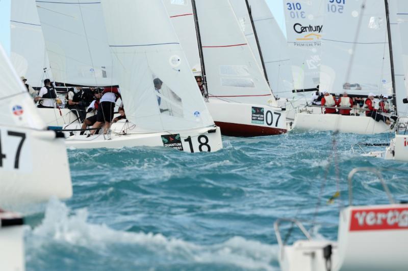 Off the start crowds in the J/70 Class on day 1 at Quantum Key West Race Week photo copyright Quantum Key West Race Week / www.PhotoBoat.com taken at Storm Trysail Club and featuring the J70 class