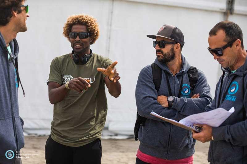 Tour legend Mitu Monteiro catches up with the judges. There aren’t many strapless riders who’ve seen more competitive heats in their careers than this guy!  photo copyright Ydwer van der Heide taken at  and featuring the Kiteboarding class