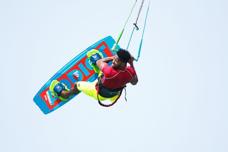 Posito smiling on the job. The man enjoys his work! photo copyright Event Media taken at  and featuring the Kiteboarding class