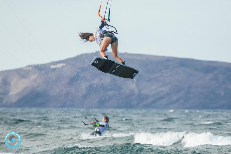 Mikaili sends a back mobe with Kajiya in the background - GKA Gran Canaria Freestyle World Cup 2019 photo copyright Svetlana Romantsova taken at  and featuring the Kiteboarding class