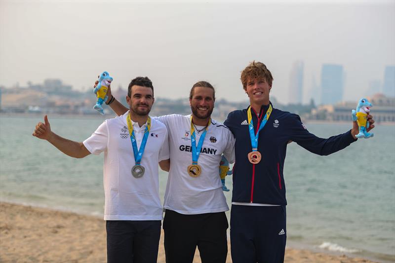 Medals award ceremony for the men's Keitfoil Racing event of the 1st ANOC World Beach Games Qatar ..1st GRUBER Florian(GER) - 2nd: PARLIER Nicolas (FRA)- 3rd: BRIDGE Guy (GBR) photo copyright Pelagia Karanikola taken at  and featuring the Kiteboarding class