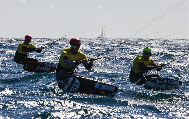 2021 Kitefoil World Series Gran Canaria - Connor Bainbridge, Martin Dolenc & Axel Mazella neck and neck in race 3 photo copyright IKA Media / Sailing Energy taken at  and featuring the Kiteboarding class