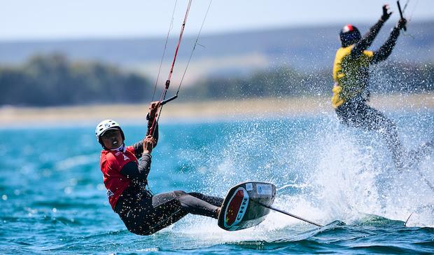 Qibin Huang of China, chased by Maeder of Singapore on Day 3 in Torregrande - IKA Kitefoiling Youth Worlds Torregrande 2022 photo copyright Robert Hajduk / IKA media taken at  and featuring the Kiteboarding class