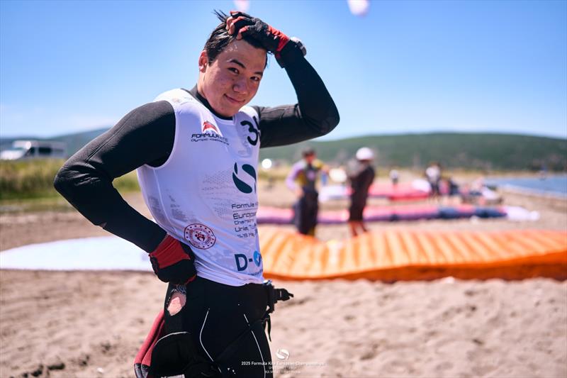 Where'd it go? Max Maeder [SGP] shows where his tracker used to be before he crashed hard in race 6 - 2025 Formula Kite European Championships, day 2 - photo © IKA Media / Robert Hajduk