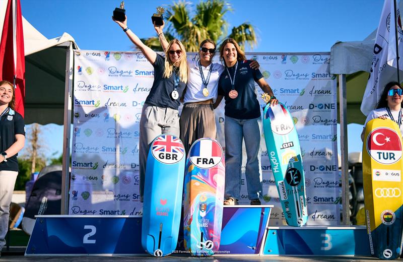 Nolot [FRA] shares the podium with silver medalist Young [GBR] and bronze medalist Caval [FRA] photo copyright IKA Media / Robert Hajduk taken at  and featuring the Kiteboarding class