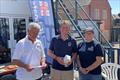 Whitstable YC RNLI Pursuit Race third-placed Niall Martin, with Commodore David Figgis and RNLI's Kellie Gray &copy; Steve Gray
