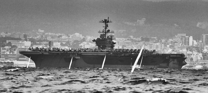 The Aircraft Carrier 'Harry S. Truman' visits on day 4 of ISAF Sailing World Cup Mallorca photo copyright Jesus Renedo / Sofia taken at  and featuring the ILCA 7 class