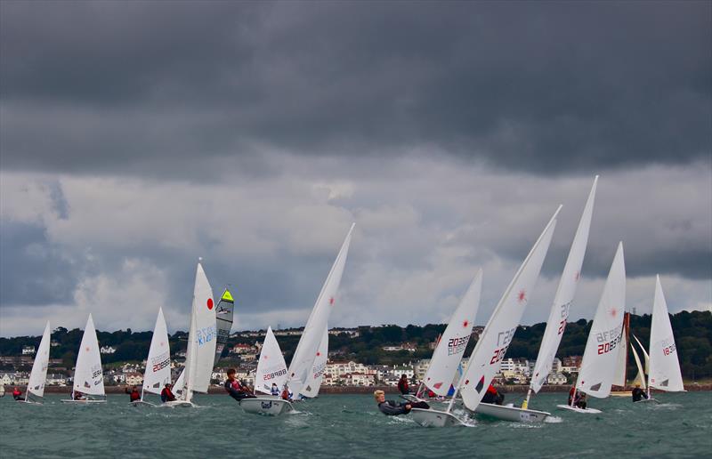 Dinghy start at the 2015 UBS Jersey Regatta photo copyright Louise Bennett-Jones taken at Royal Channel Islands Yacht Club and featuring the ILCA 7 class