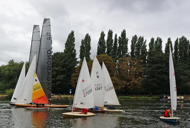 Young man in a hurry: Ed Mayley in his Topper leads the handicap fleet on the way to his fourth victory, as the Thames Raters come through the start line completing their first lap at the Minima Regatta - photo © John Forbes & Alastair Banks