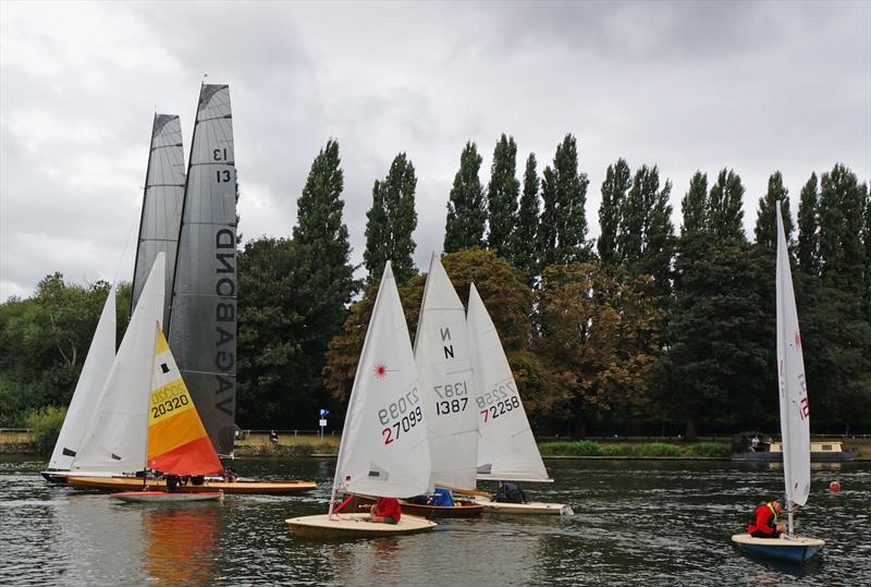 Young man in a hurry: Ed Mayley in his Topper leads the handicap fleet on the way to his fourth victory, as the Thames Raters come through the start line completing their first lap at the Minima Regatta photo copyright John Forbes & Alastair Banks taken at Minima Yacht Club and featuring the ILCA 7 class