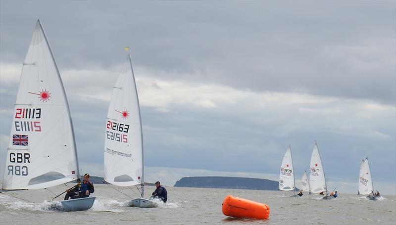 Ed Higson (right hand of nearest boats) and Ben Flower battling for the lead during the Laser and Enterprise Open at Penarth photo copyright Tracey Dunford taken at Penarth Yacht Club and featuring the ILCA 7 class