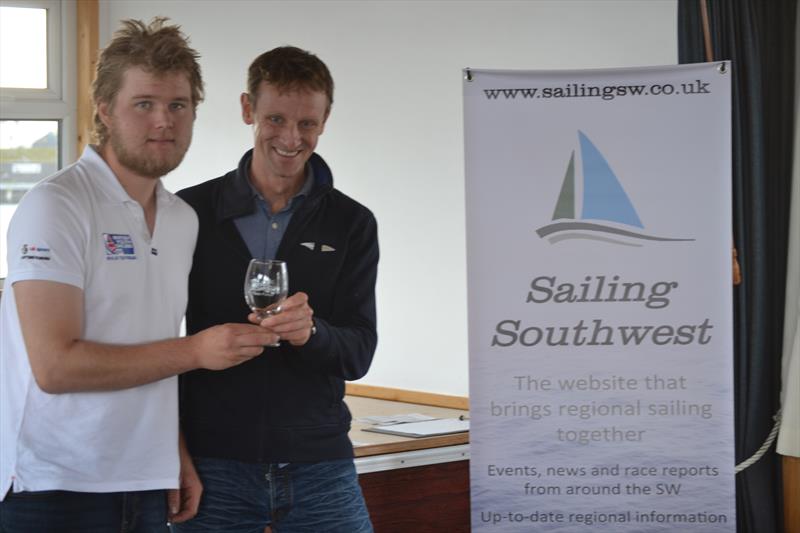 Ben Flower receiving the prize for the fastest boat at the abandoned Penzance Pirate photo copyright Jonathan Miles / Sailing Southwest taken at Penzance Sailing Club and featuring the ILCA 7 class