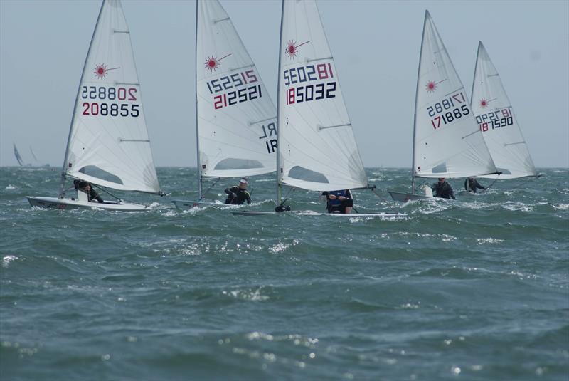 Sun, wind and waves during the Lennon Irish Laser Masters photo copyright Heather King taken at Royal St George Yacht Club and featuring the ILCA 7 class