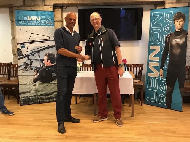 First Full rig, Mike Matan (RYA) receives his gold medal from Bowring at the Lennon Irish Laser Masters photo copyright Heather King taken at Royal St George Yacht Club and featuring the ILCA 7 class